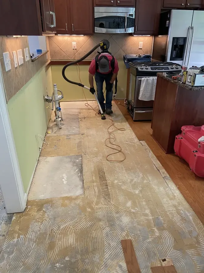 Washing machine supply line leak flooding a laundry room