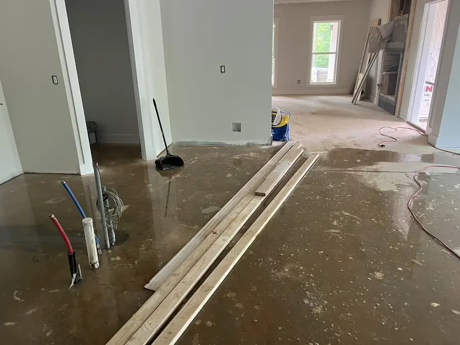 Burst water supply line spraying inside a Four Oaks home